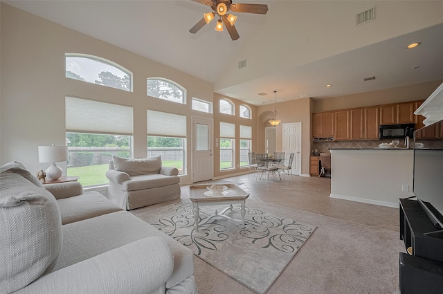 15902 Mill Canyon Ct, Cypress, TX 77429 - living room with high vaulted ceiling, a ceiling fan, recessed lighting, and light tile patterned flooring