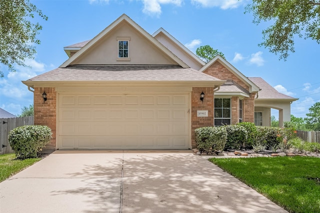 15902 Mill Canyon Ct, Cypress, TX 77429 - traditional home with driveway, brick siding, an attached garage, and a shingled roof