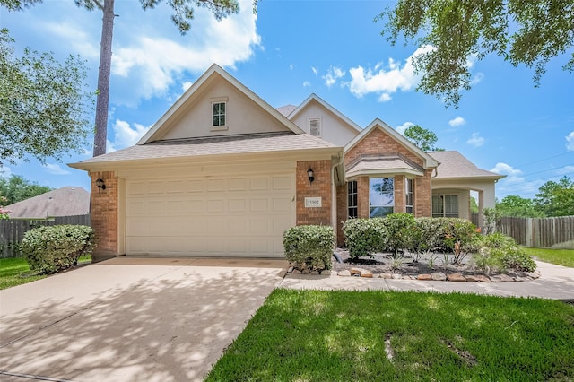15902 Mill Canyon Ct, Cypress, TX 77429 - traditional-style home featuring brick siding, stucco siding, concrete driveway, and a garage