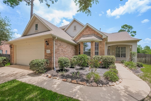15902 Mill Canyon Ct, Cypress, TX 77429 - traditional home featuring brick siding, stucco siding, a garage, and driveway