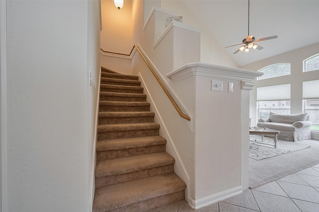 15902 Mill Canyon Ct, Cypress, TX 77429 - stairway with carpet flooring, tile patterned floors, high vaulted ceiling, and a ceiling fan