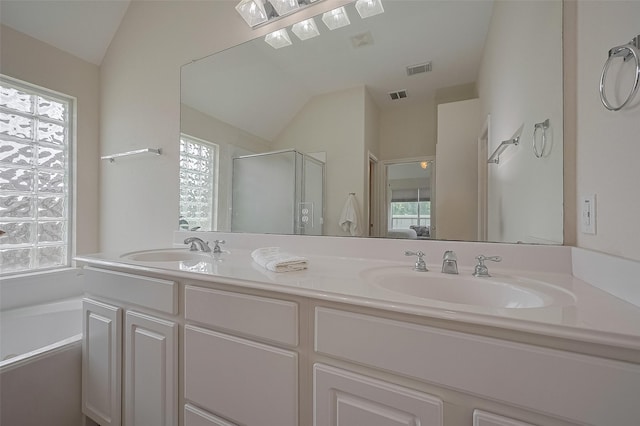 15902 Mill Canyon Ct, Cypress, TX 77429 - bathroom featuring vaulted ceiling, a stall shower, plenty of natural light, double vanity, and a garden tub