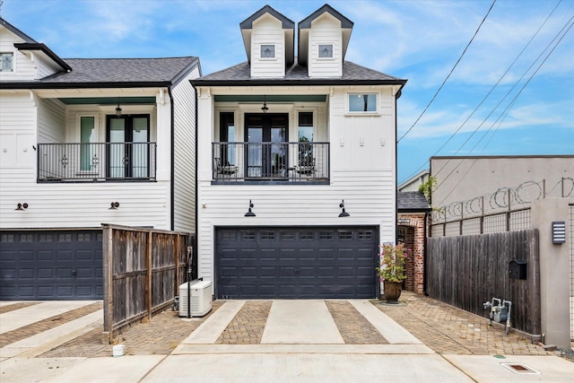 1212 Bingham St, Houston, TX 77007 - view of front of house with driveway, a garage, and roof with shingles