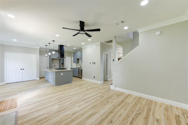 13727 Sablegarden Ln, Houston, TX 77014 - kitchen featuring wall chimney range hood, crown molding, ceiling fan, light wood-style flooring, and stainless steel dishwasher