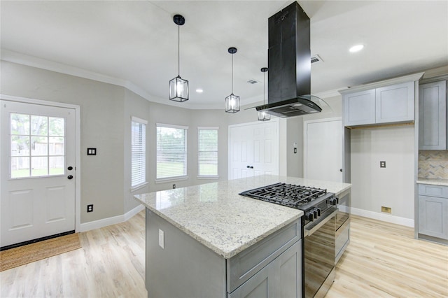 13727 Sablegarden Ln, Houston, TX 77014 - kitchen with black gas stove, gray cabinets, island exhaust hood, light wood-type flooring, and light stone counters