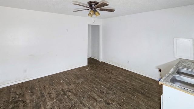 242 Bishop, Livingston, TX 77351 - spare room featuring wood finished floors, ceiling fan, and a textured ceiling