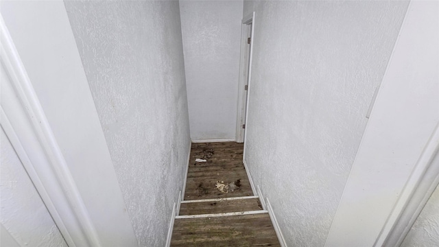 242 Bishop, Livingston, TX 77351 - staircase featuring a textured wall