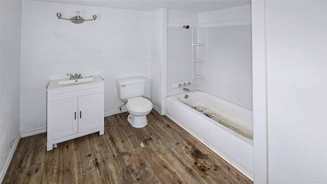 242 Bishop, Livingston, TX 77351 - bathroom featuring wood finished floors, vanity, and bathing tub / shower combination