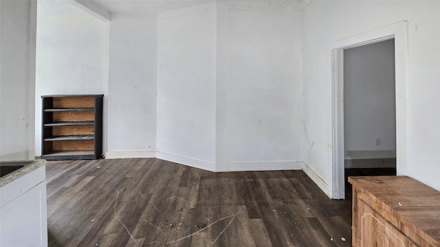 242 Bishop, Livingston, TX 77351 - unfurnished dining area with dark wood finished floors and baseboards