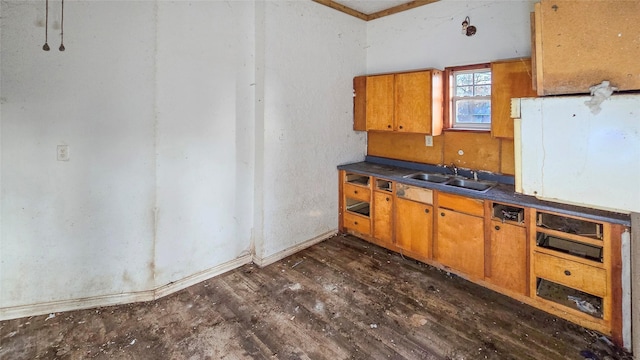 242 Bishop, Livingston, TX 77351 - kitchen featuring dark wood finished floors, dark countertops, and brown cabinets