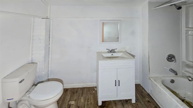 242 Bishop, Livingston, TX 77351 - full bathroom featuring vanity, wood finished floors, and washtub / shower combination