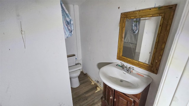 242 Bishop, Livingston, TX 77351 - bathroom with vanity and wood finished floors
