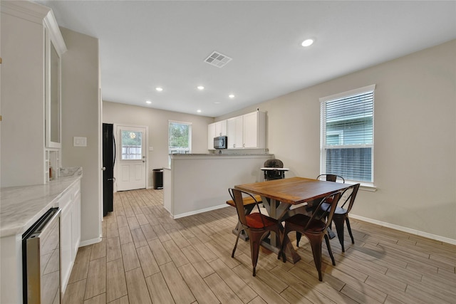 24715 Winema Woods Ln, Huffman, TX 77336 - dining area featuring light wood-type flooring and recessed lighting