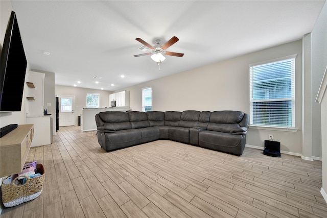 24715 Winema Woods Ln, Huffman, TX 77336 - living area with a ceiling fan, light wood finished floors, and recessed lighting