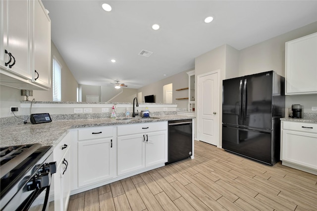 24715 Winema Woods Ln, Huffman, TX 77336 - kitchen featuring black appliances, a peninsula, a ceiling fan, white cabinetry, and recessed lighting
