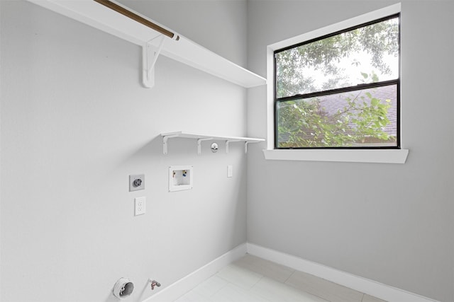 806 E 39th St Unit A, Houston, TX 77022 - washroom featuring hookup for a gas dryer, electric dryer hookup, hookup for a washing machine, and light tile patterned floors