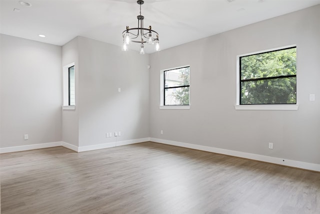 806 E 39th St Unit A, Houston, TX 77022 - empty room featuring a chandelier, wood finished floors, and recessed lighting