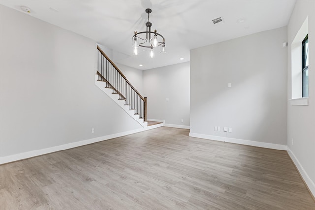 806 E 39th St Unit A, Houston, TX 77022 - unfurnished living room with stairway, a chandelier, wood finished floors, and recessed lighting