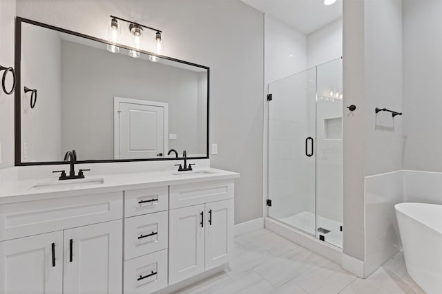 806 E 39th St Unit A, Houston, TX 77022 - full bath featuring a stall shower, a freestanding bath, double vanity, and marble look tiles
