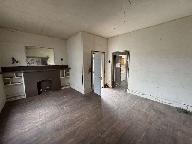 509 N Waggoner St, Electra, TX 76360 - unfurnished living room featuring wood finished floors