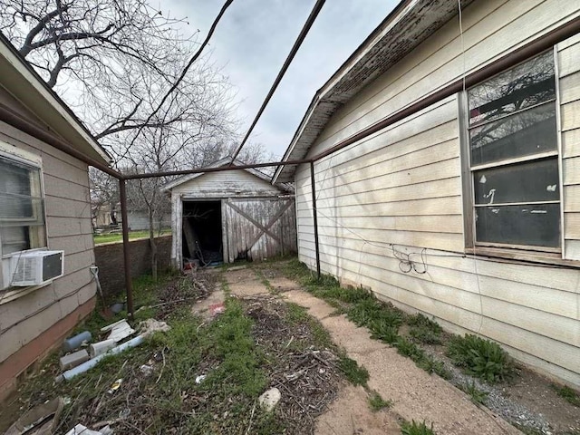509 N Waggoner St, Electra, TX 76360 - view of yard featuring cooling unit and a shed