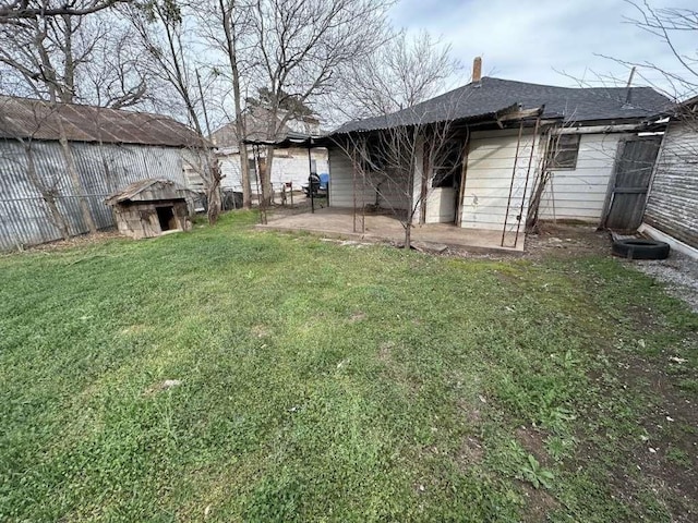509 N Waggoner St, Electra, TX 76360 - view of yard featuring a patio