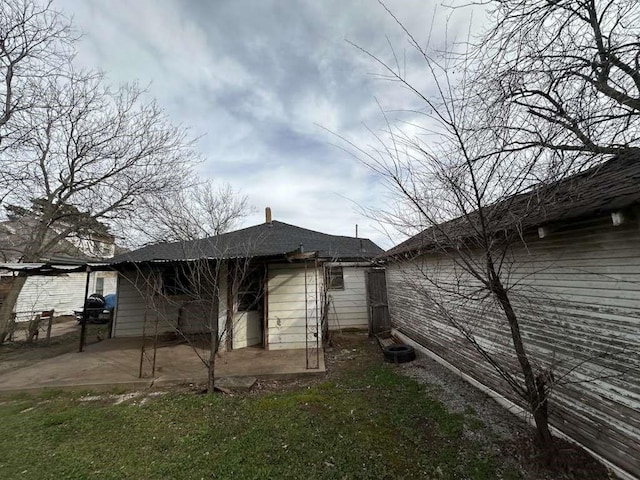 509 N Waggoner St, Electra, TX 76360 - rear view of property featuring a patio