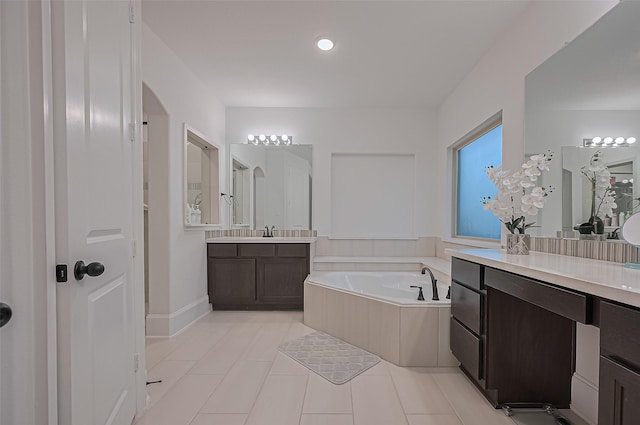 9011 Bright Harbor Dr, Cypress, TX 77433 - full bathroom featuring a bath, two vanities, and tile patterned floors