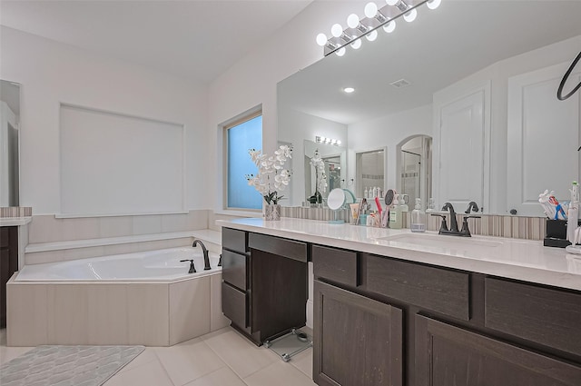 9011 Bright Harbor Dr, Cypress, TX 77433 - full bathroom featuring vanity, a bath, tile patterned floors, and a stall shower