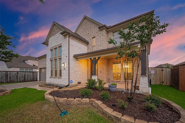 9011 Bright Harbor Dr, Cypress, TX 77433 - traditional-style house featuring a porch, brick siding, concrete driveway, and a gate