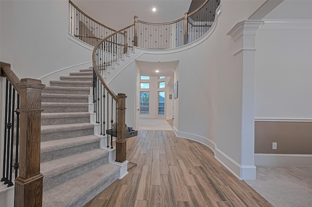 9011 Bright Harbor Dr, Cypress, TX 77433 - entrance foyer featuring stairs, wood finished floors, and a towering ceiling