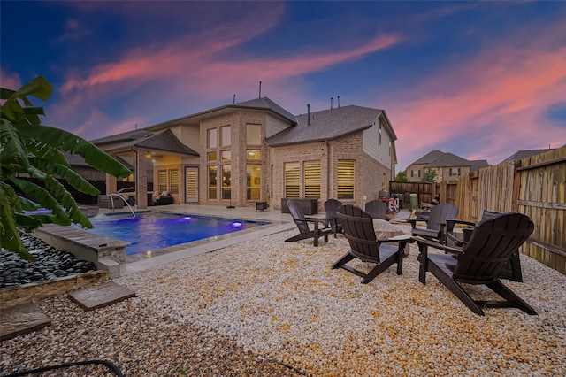 9011 Bright Harbor Dr, Cypress, TX 77433 - pool at dusk with a patio