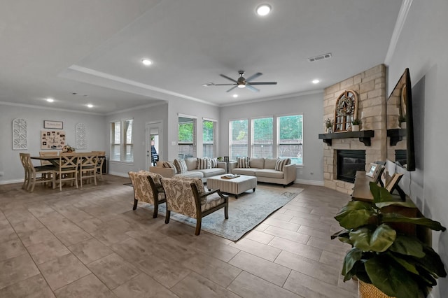 25119 Dunbrook Springs Ln, Katy, TX 77494 - living area featuring ornamental molding, ceiling fan, a fireplace, and recessed lighting