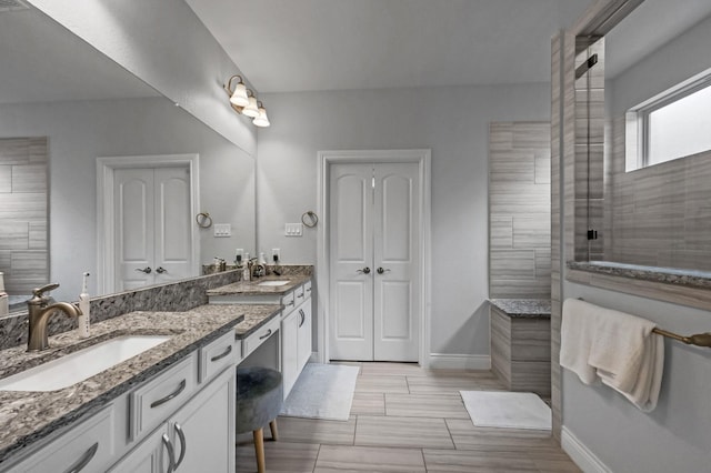 25119 Dunbrook Springs Ln, Katy, TX 77494 - bathroom featuring double vanity and a walk in shower