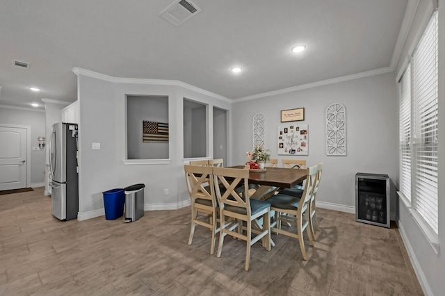 25119 Dunbrook Springs Ln, Katy, TX 77494 - dining space with crown molding, light wood-style flooring, and recessed lighting