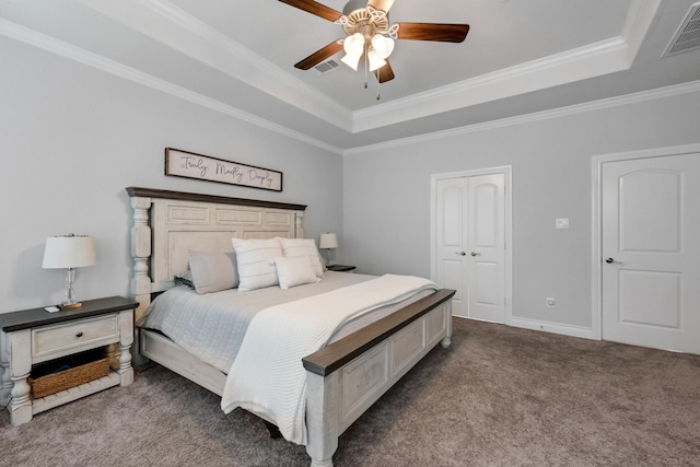25119 Dunbrook Springs Ln, Katy, TX 77494 - carpeted bedroom featuring a raised ceiling, ornamental molding, a ceiling fan, and a closet
