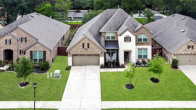25119 Dunbrook Springs Ln, Katy, TX 77494 - view of front of home featuring concrete driveway, brick siding, a garage, and a shingled roof