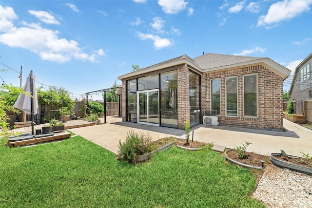 18402 Ingliston Ln, Richmond, TX 77407 - rear view of property featuring brick siding, a patio area, and a fenced backyard