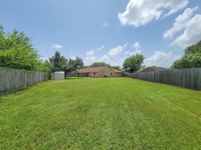 17602 Kakerglen Ct, Houston, TX 77084 - fenced backyard featuring a storage unit