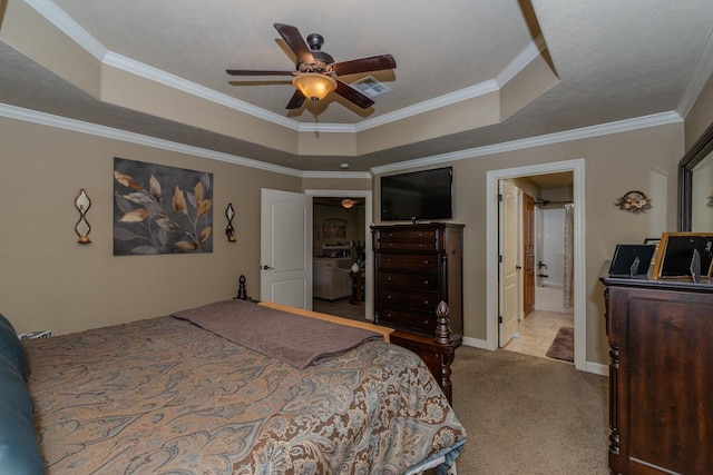 5720 Sunbird Ln, Beaumont, TX 77708 - bedroom with a raised ceiling, ornamental molding, carpet floors, ceiling fan, and ensuite bathroom