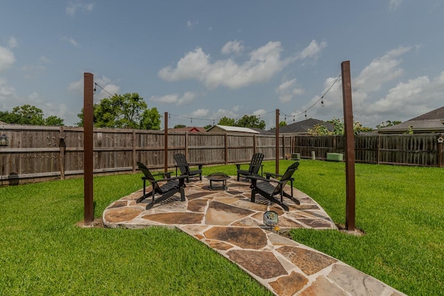 5720 Sunbird Ln, Beaumont, TX 77708 - fenced backyard with an outdoor fire pit and a patio