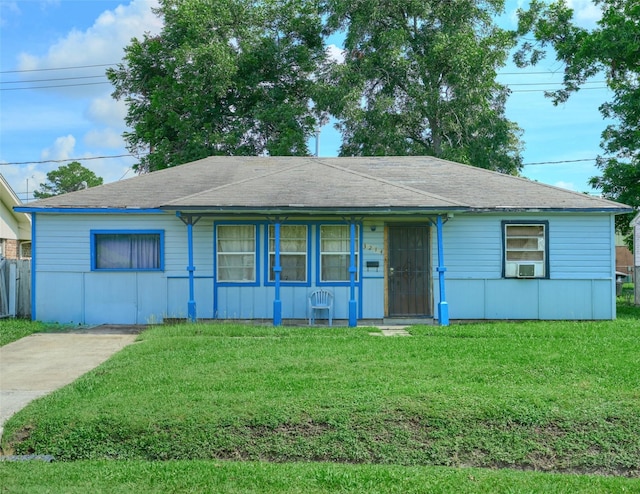 3214 Stallings Dr, Houston, TX 77088 - ranch-style house with a front lawn, cooling unit, and a shingled roof