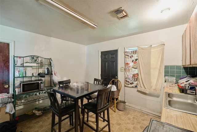 3214 Stallings Dr, Houston, TX 77088 - dining space featuring light flooring and baseboards