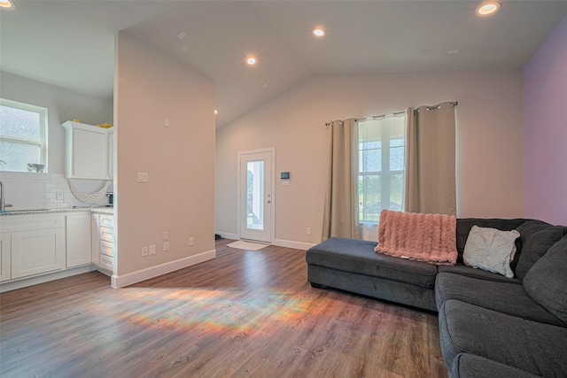 6418 Gresham St, Wallis, TX 77485 - living room with plenty of natural light, light wood-style flooring, recessed lighting, and lofted ceiling