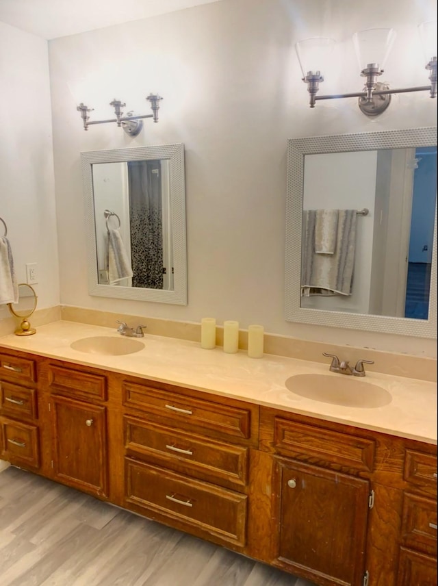 16510 De Lozier St, Jersey Village, TX 77040 - bathroom with double vanity and wood finished floors