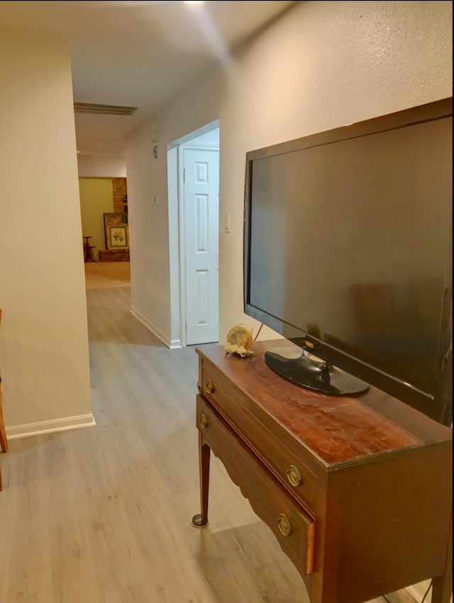 16510 De Lozier St, Jersey Village, TX 77040 - hallway featuring light wood-style flooring and baseboards