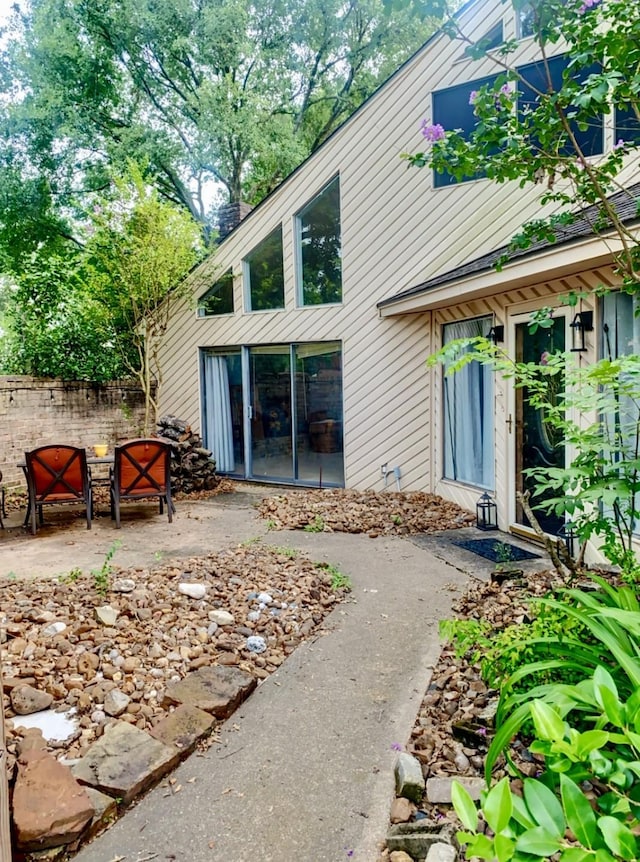 16510 De Lozier St, Jersey Village, TX 77040 - rear view of property featuring a patio