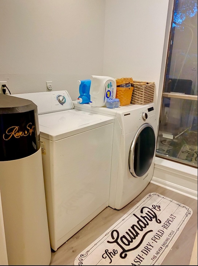 16510 De Lozier St, Jersey Village, TX 77040 - laundry area featuring washer and clothes dryer and light wood-style floors