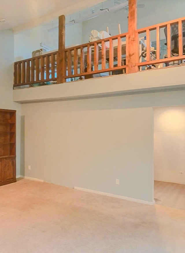 16510 De Lozier St, Jersey Village, TX 77040 - carpeted empty room with a high ceiling and baseboards
