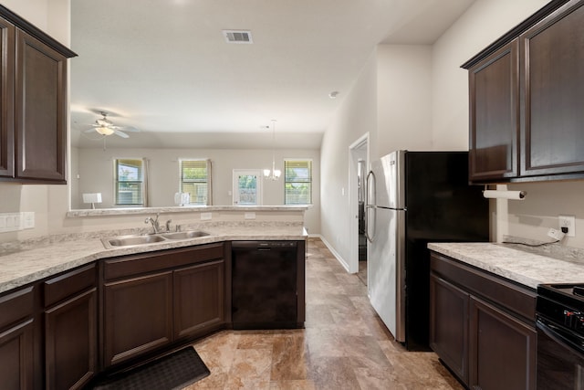 10750 Nathaniel Valley Path, Houston, TX 77016 - kitchen featuring black appliances and dark brown cabinets